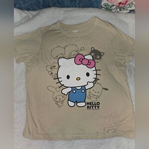 Hello Kitty Graphic Tee in Beige with Pink Bow and Blue Overalls